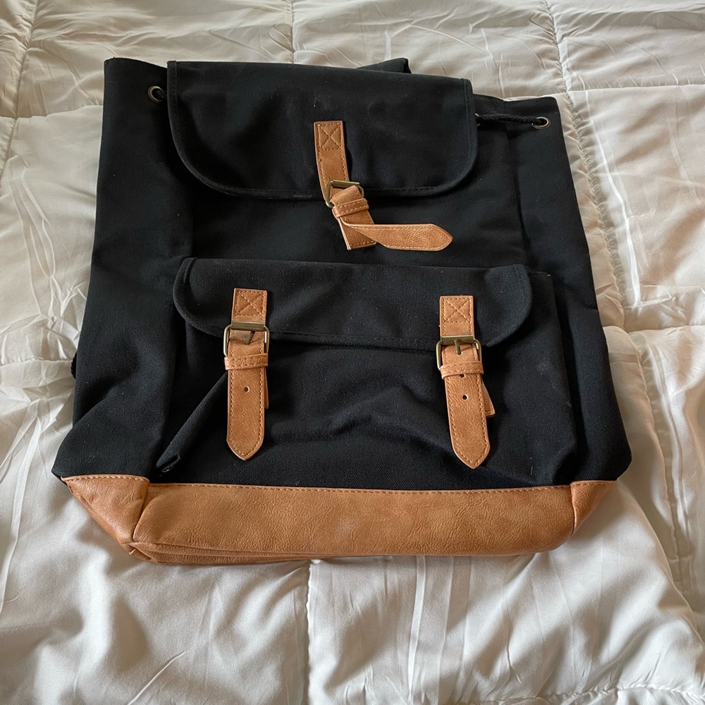 DSW black canvas and brown drawstring leather strap buckle leather backpack
